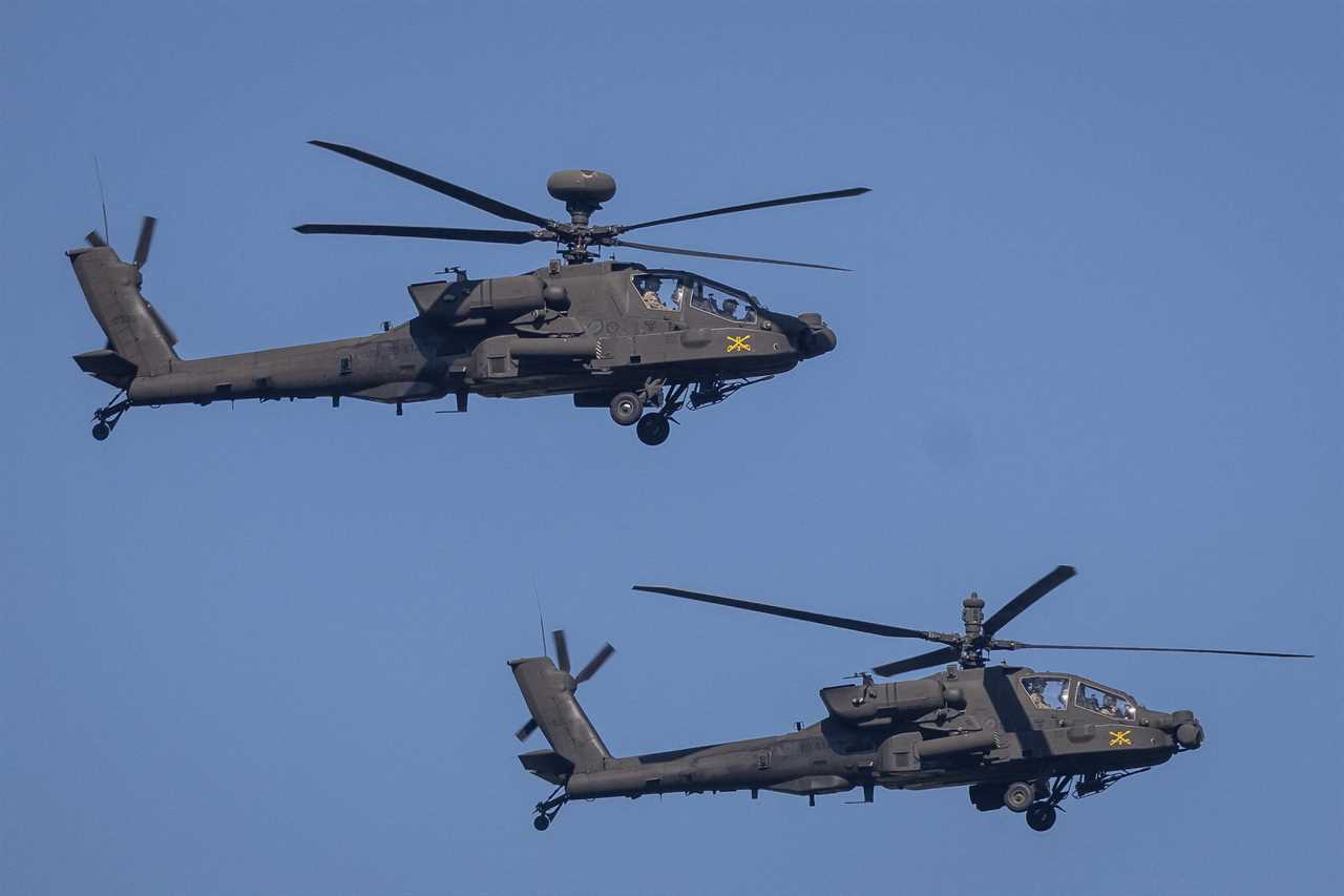 Two helicopters in flight.