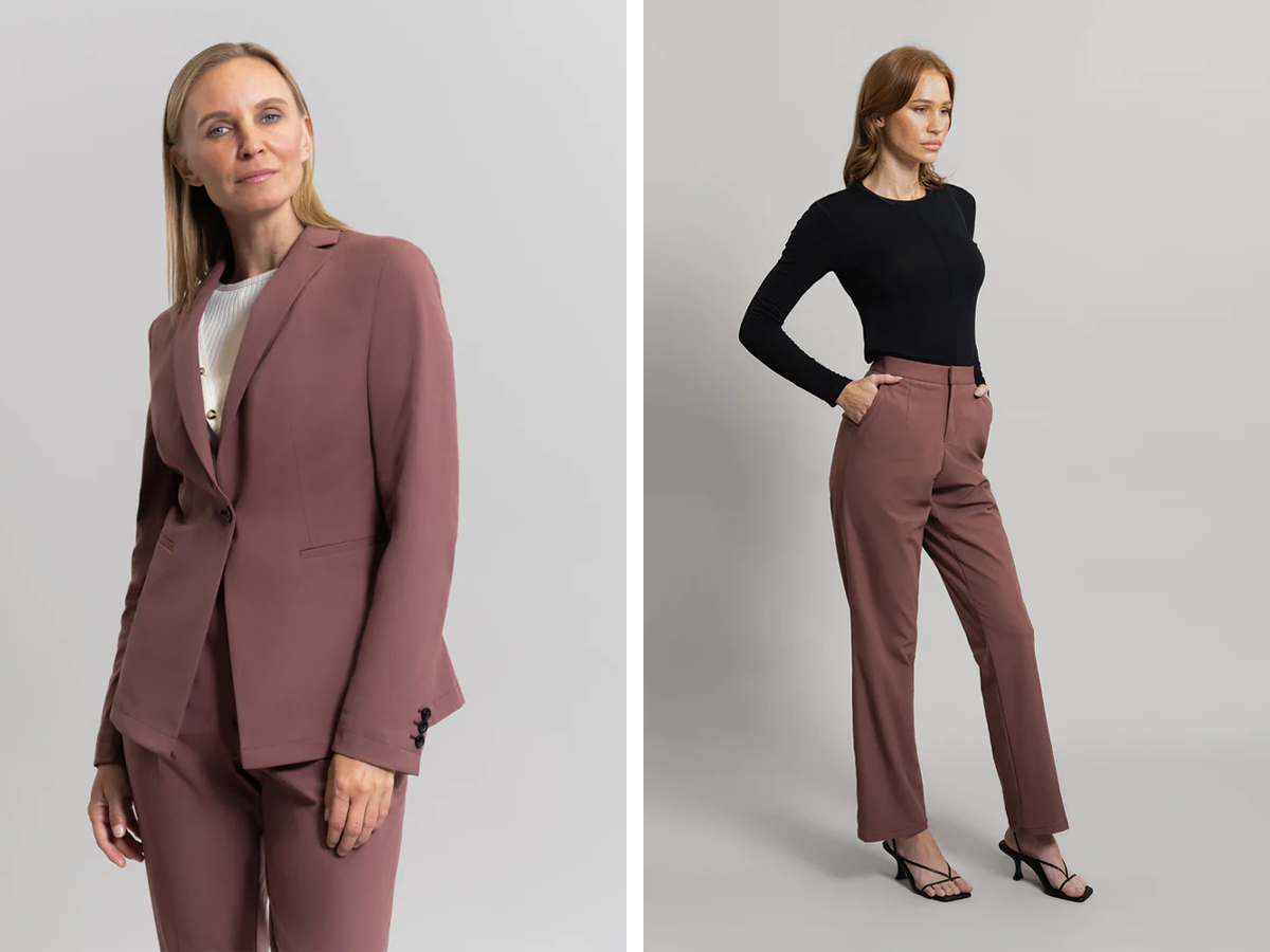 Side by side of two people wearing pieces of a reddish brown Sene suit. On the right, a person wears the blazer over a white shirt. On the left, a person wears the suit trousers with a black long sleeve top.