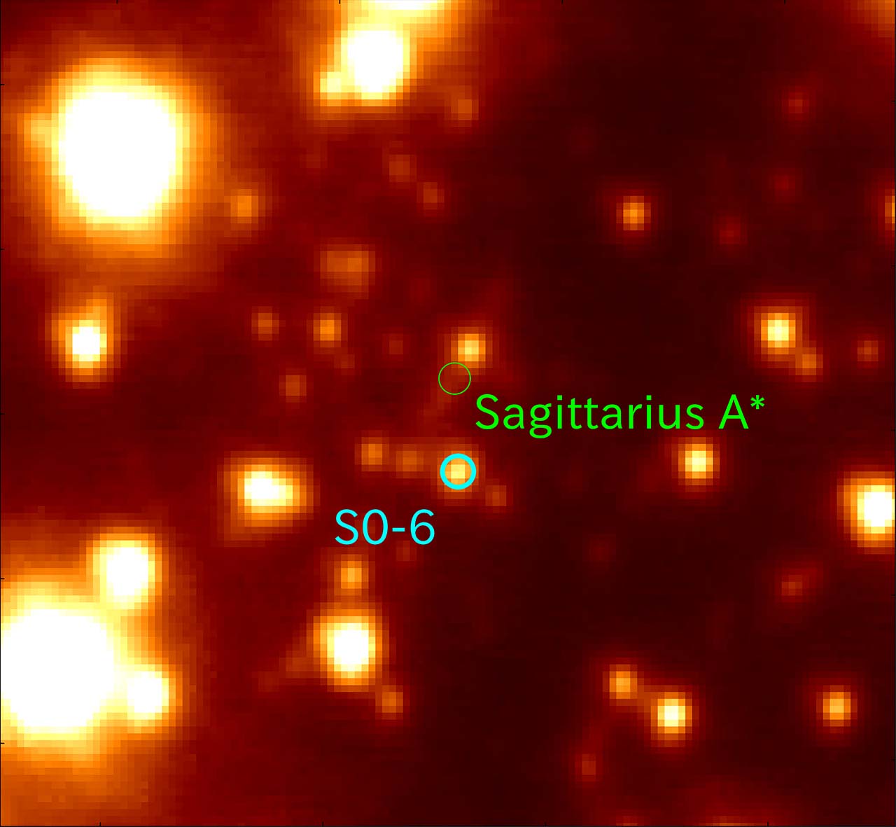 A picture shows a star near the region where the Sagittarius  A* black hole should be. The picture looks like yellow blobs on a dark background, two circles highlight the location of the star and the black hole.