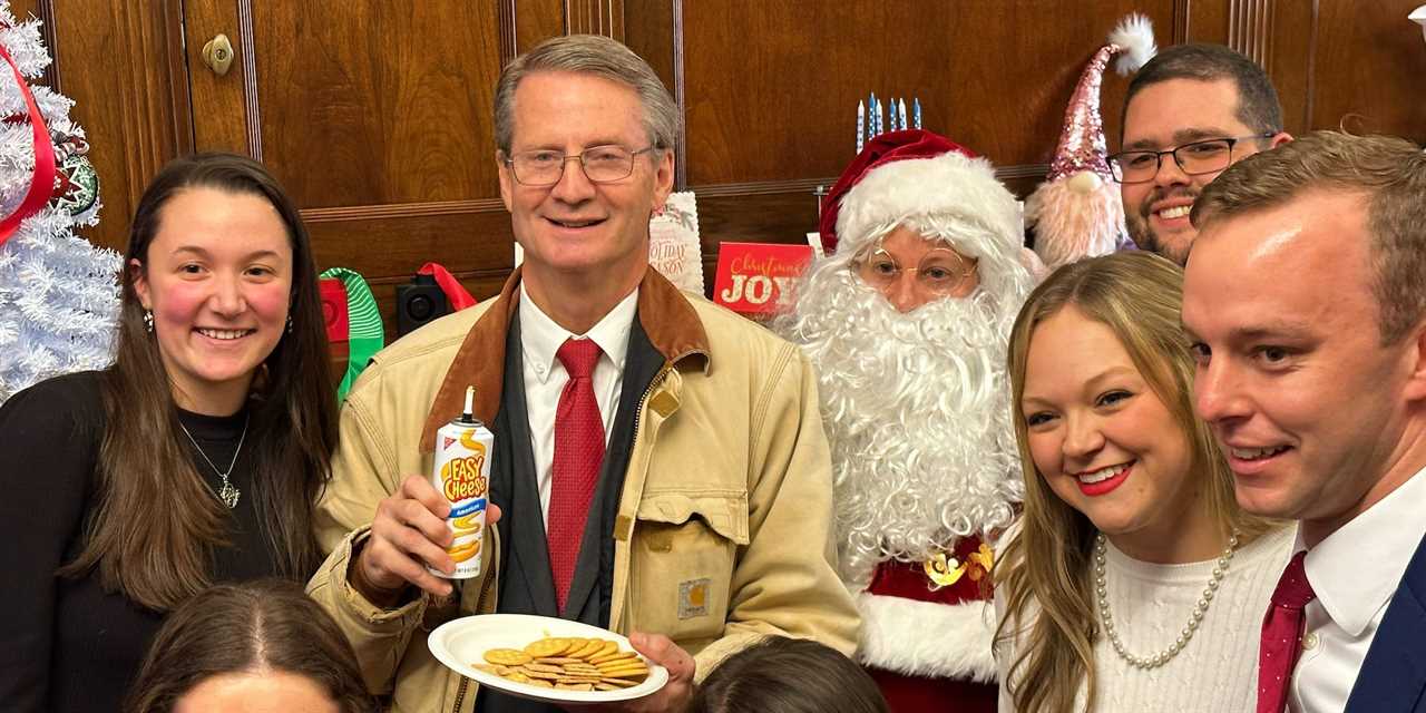 Rep. Tim Burchett and Rep. Jared Moskowitz, dressed like Santa Claus, at the 16-minute Christmas party.