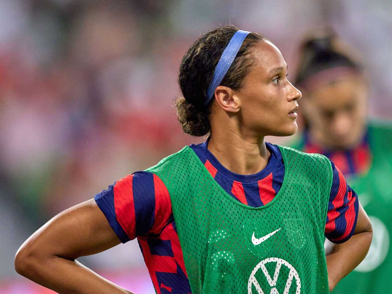 Lynn Williams waits for a USWNT substitution.