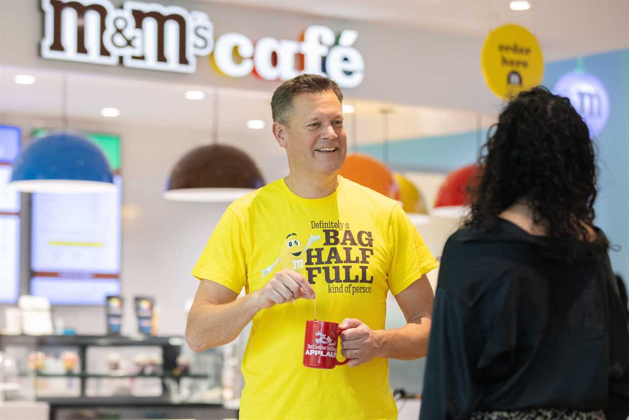 Andrew Clarke drinks tea at the office.