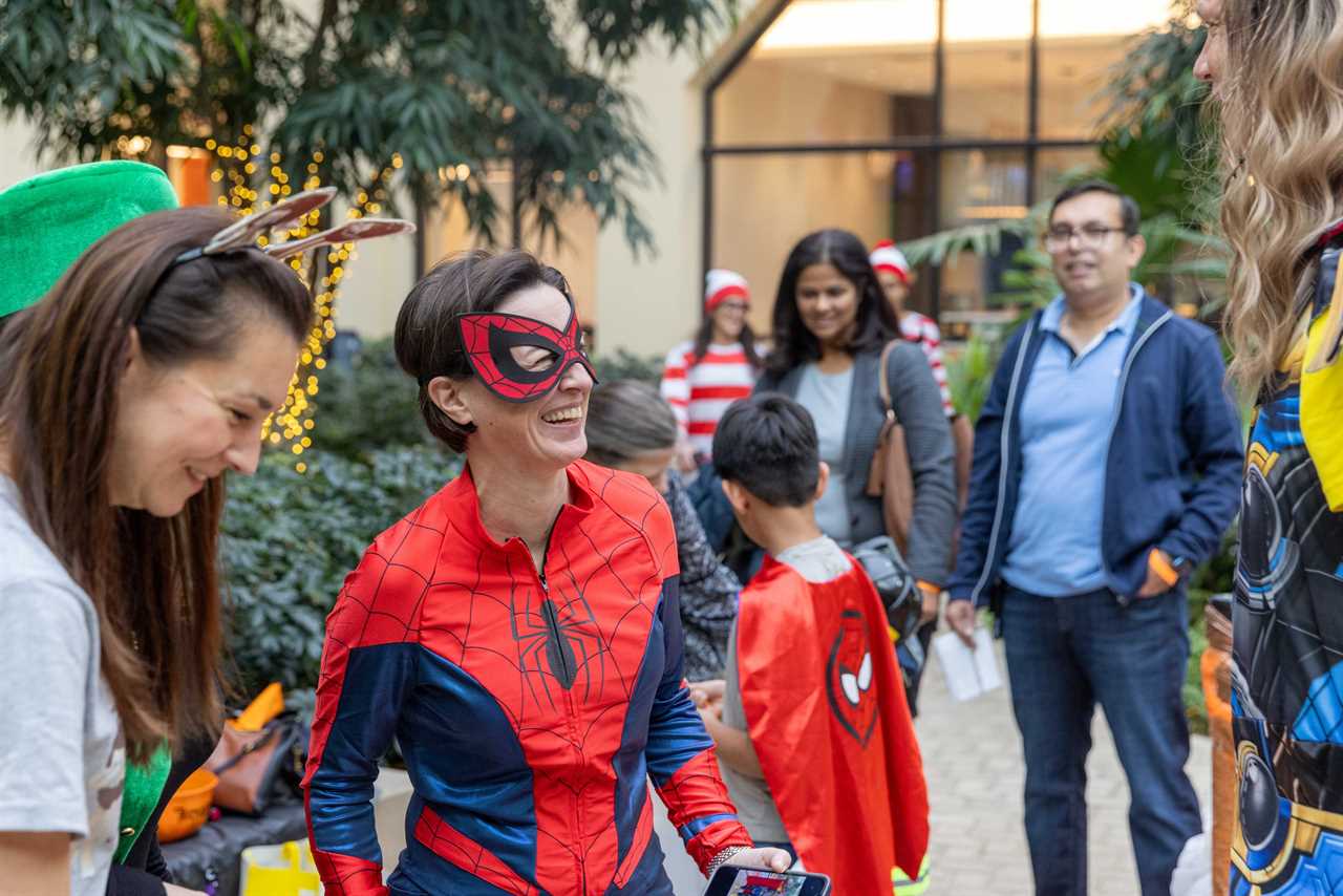 Associates join the annual 'Boo-Bash' and bring their families to the office for an afternoon of games and trick-or-treating.