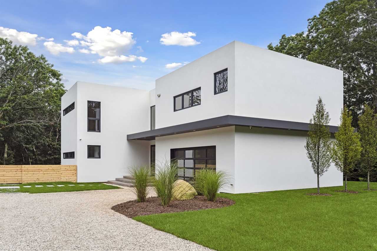 The home in Sag Harbor features a low-maintenance stucco exterior with durable Azek trim, a material palette that emphasizes the clean, modern lines of the architecture.