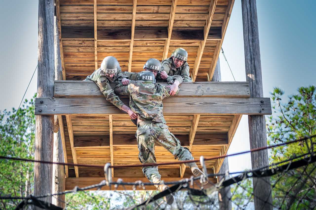 Trainees complete the sand hill obstacle course