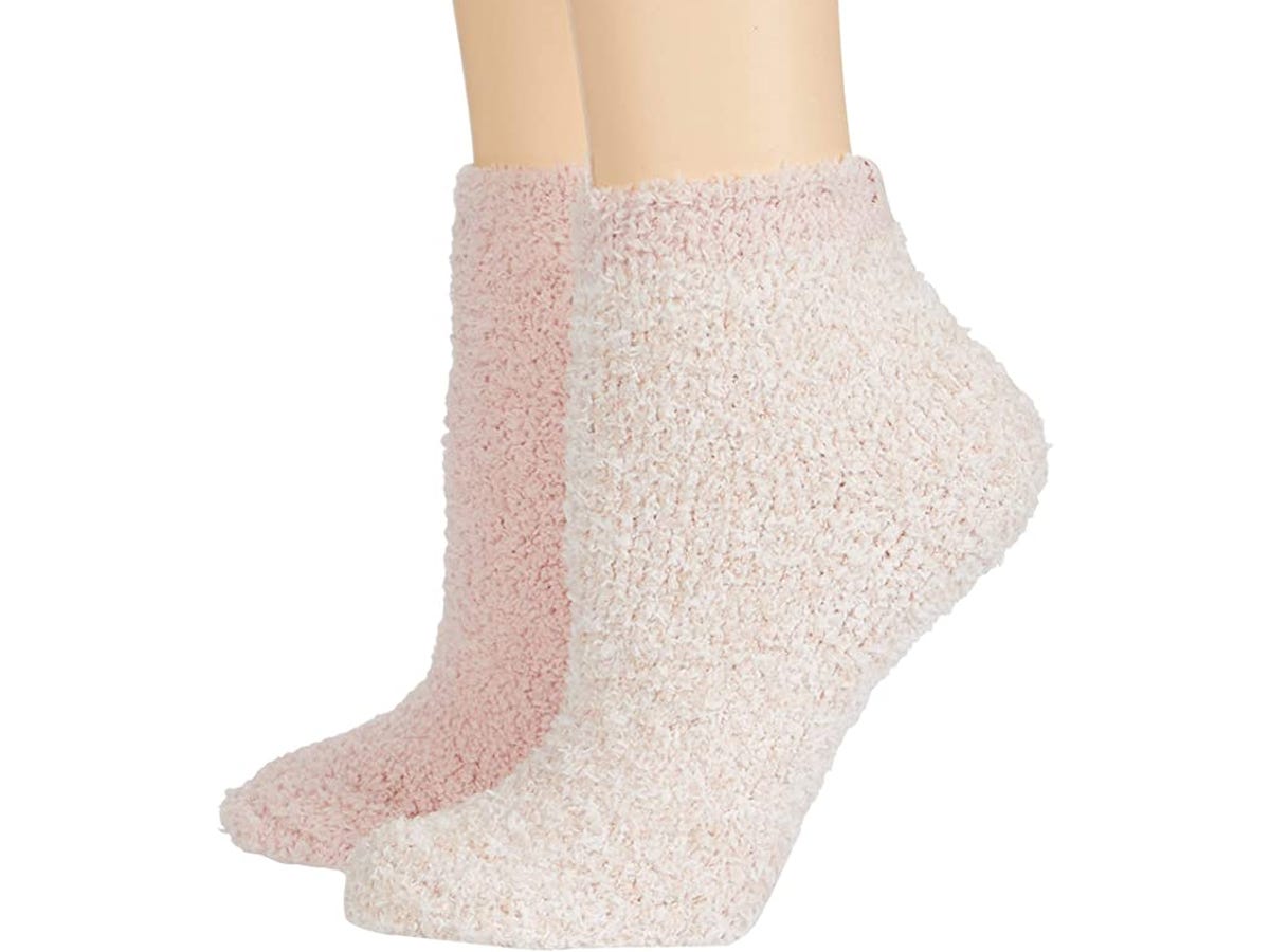 a pair of rose Barefoot  Dreams CozyChic Ankle Socks (2-Pack) on mannequin feet