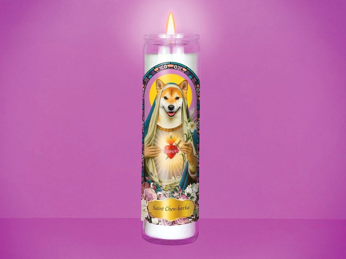 custom prayer candle with an illustration of Shiba Inu dressed to look like a saint on it.