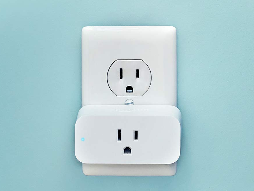 Alexa enabled smart plug in a wall outlet.