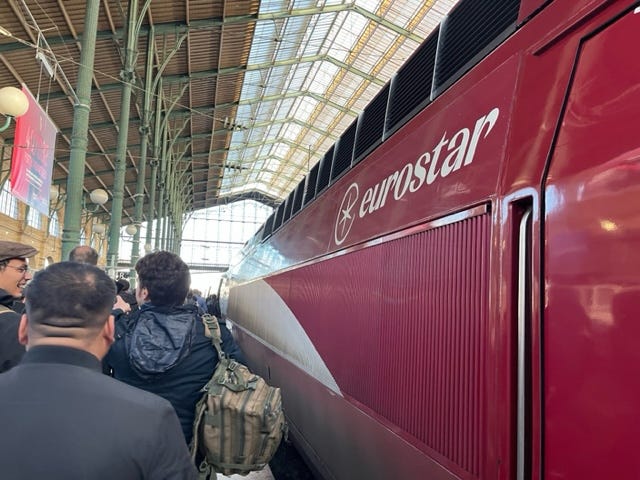 people waiting to board a eurostar train at gare du nord station in paris