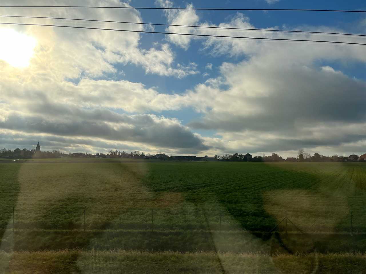 view of european countryside out a window on a eurostar train