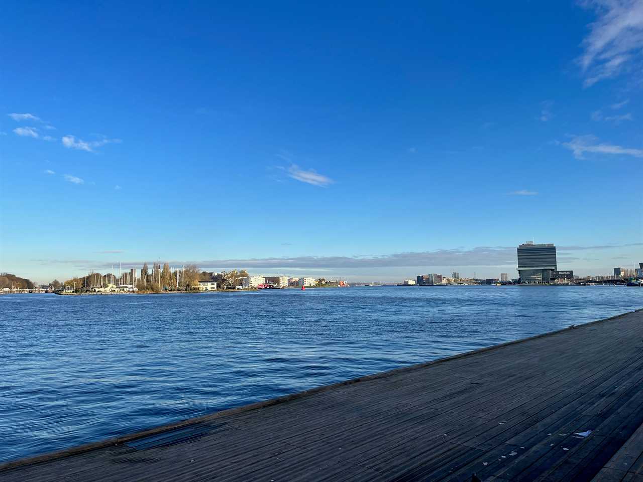 views of IJ waterfront in Amsterdam outside of the train station