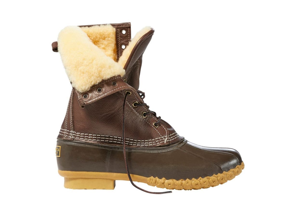 A brown L.L.Bean 10-inch Shearling-Lined Bean Boots sits unlaced and open to show the lining.