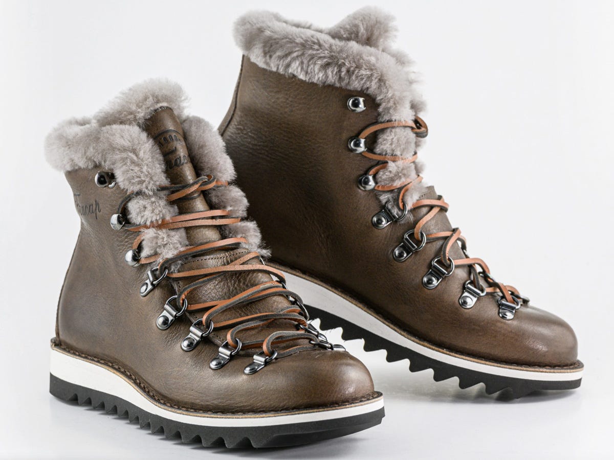 A pair of Fracap M120 Alto Brill Boots sit at different angles to show the boot at different views.