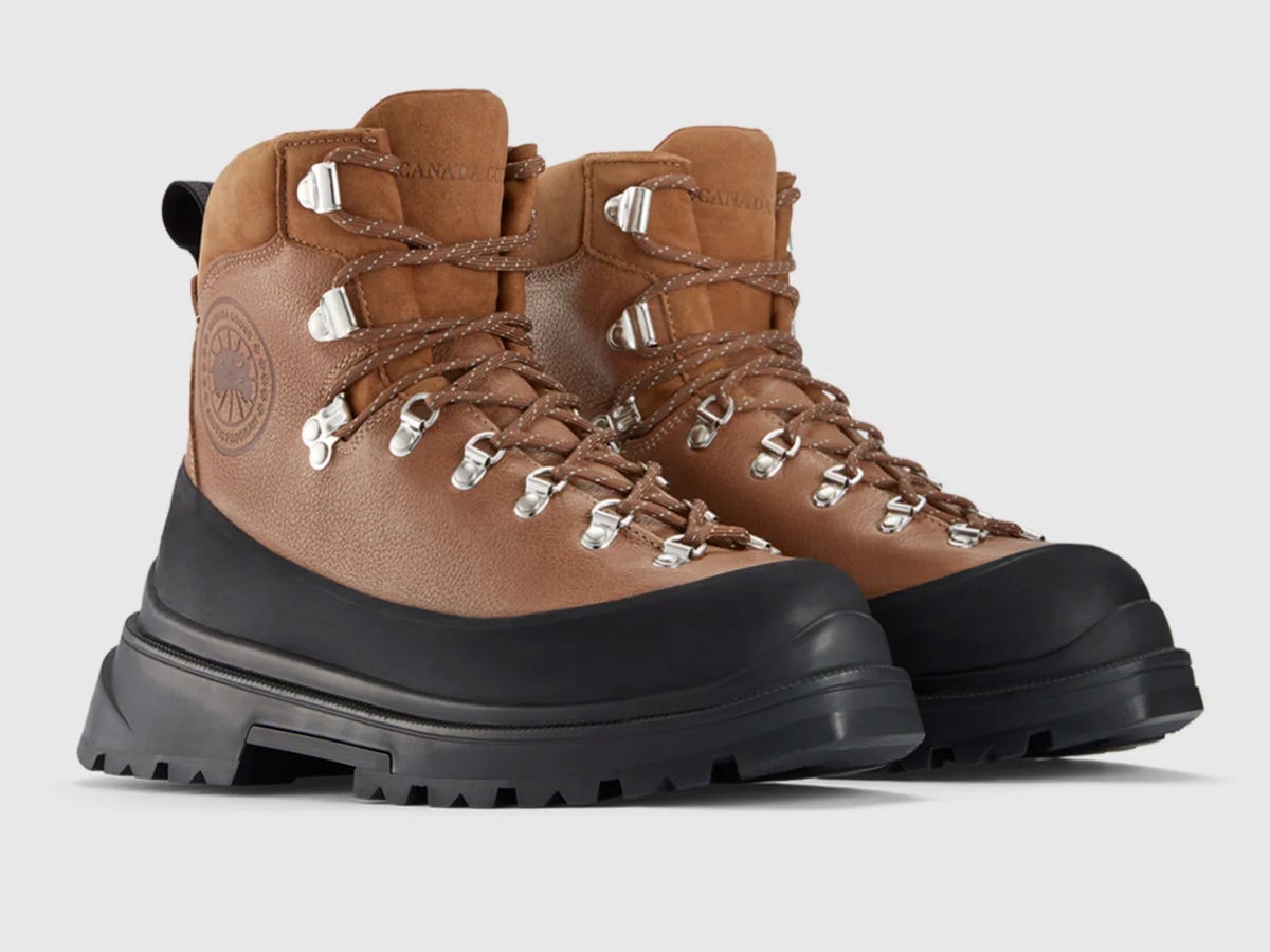 A pair of Canada Goose Journey Boots in dark cedarwood and black.