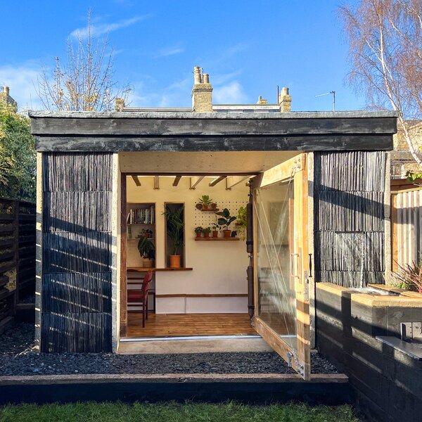 The facade’s repurposed slate roof tiles also act as a 