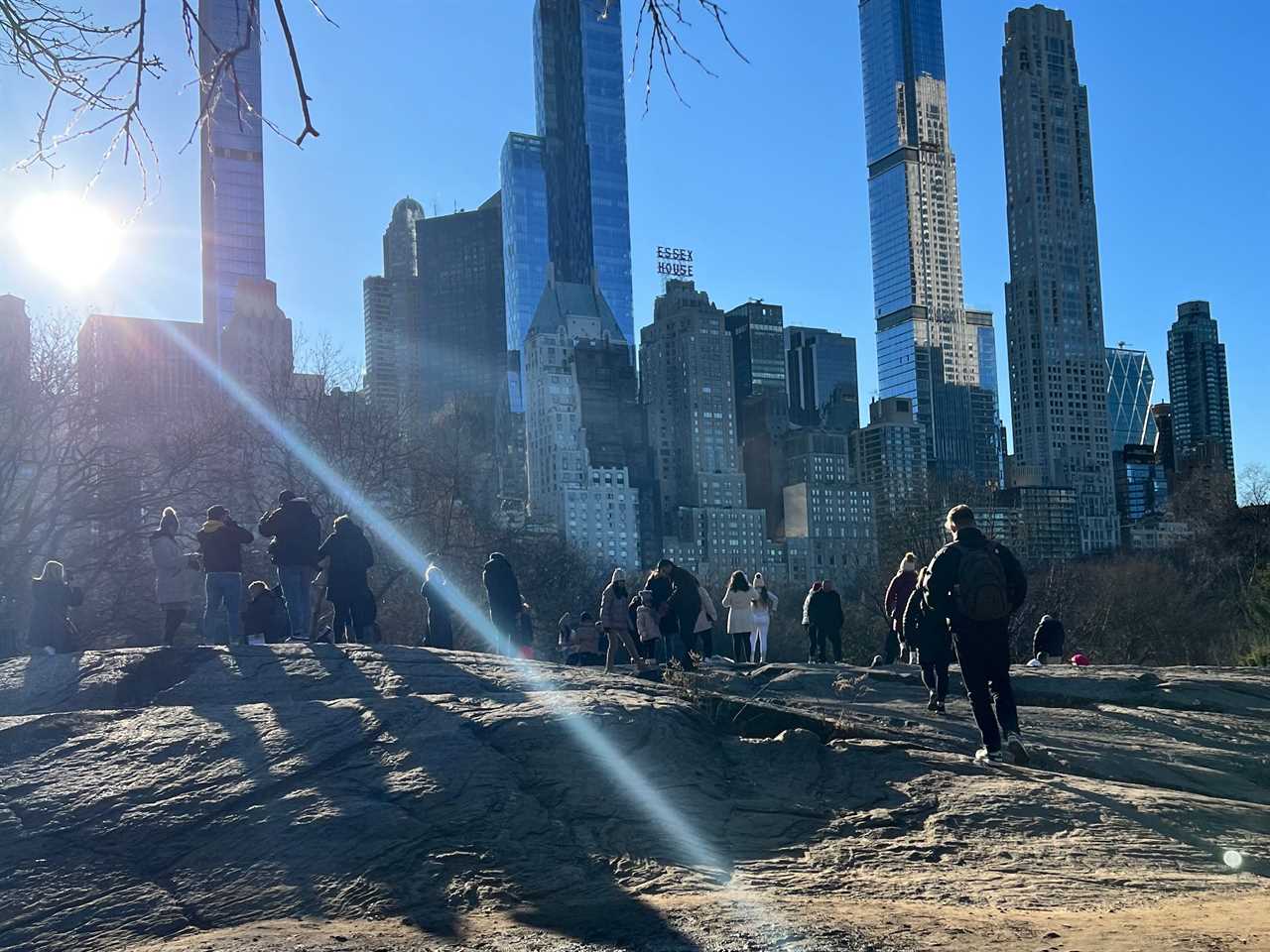 people staring at ice skaters at central park