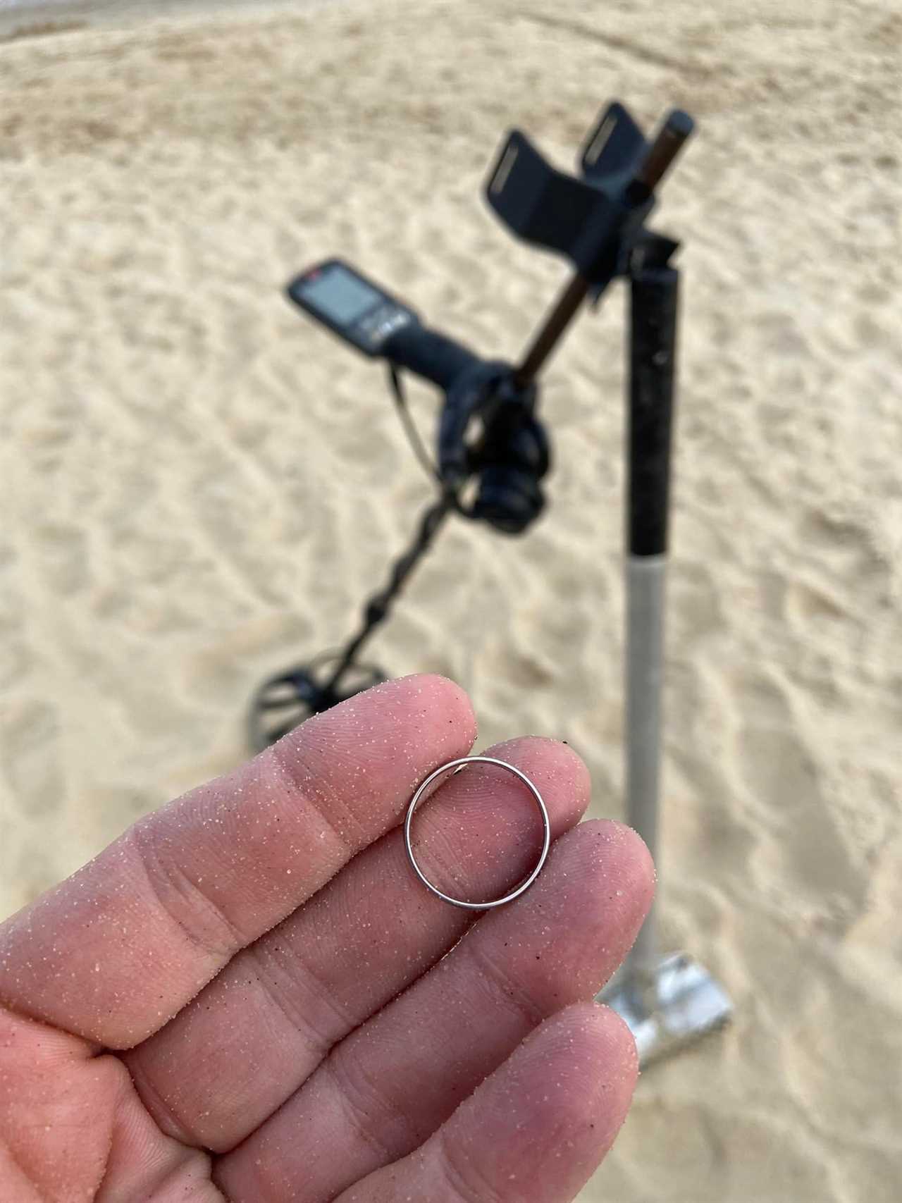 Darren Wiles holding a ring with his equipment seen in the background.