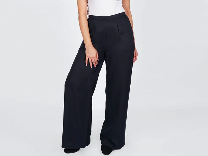 A person wearing the AAM the Wide Leg Pant in black.