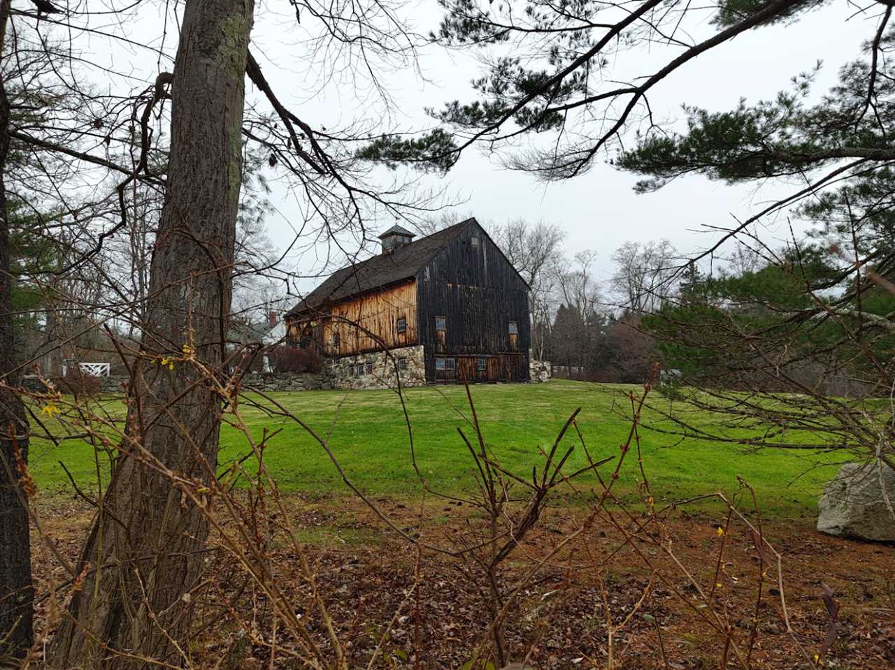 A barn in the winter with the Nothing Phone 2.