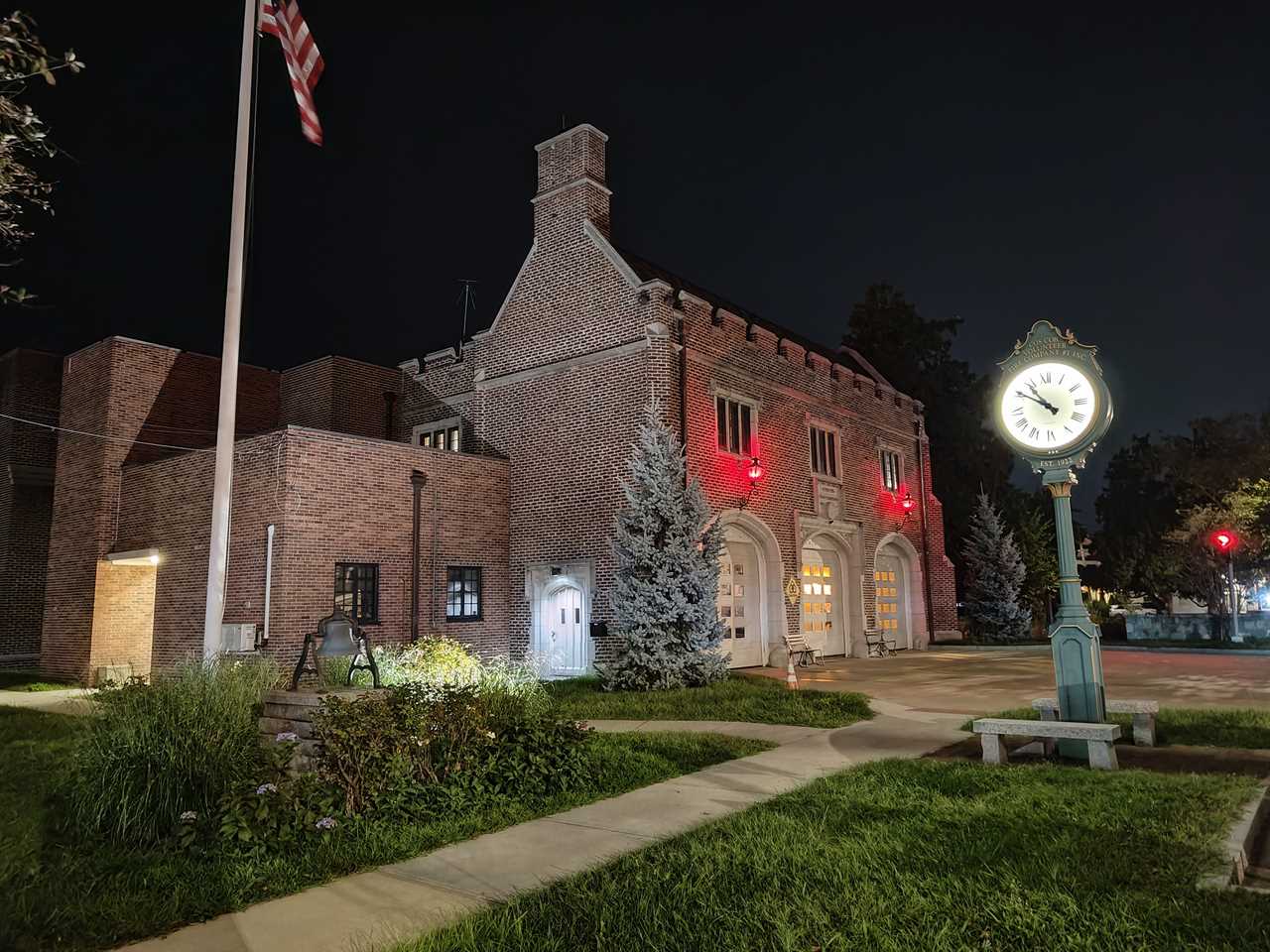 A firehouse at night with the Nothing Phone 2.