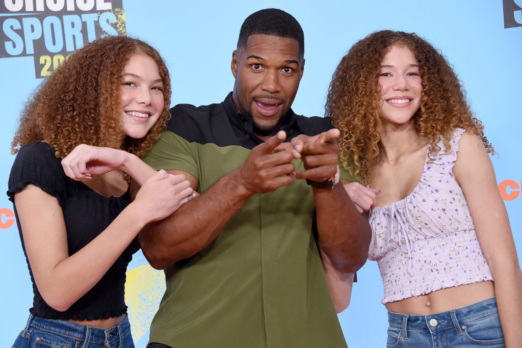 Michael Strahan with twin daughters Sophia and Isabella Strahan.