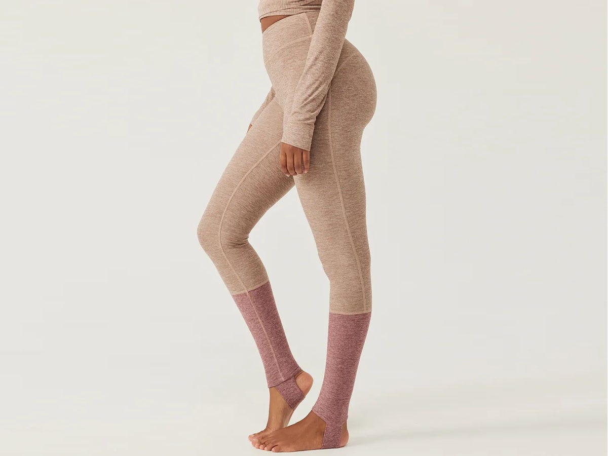 Woman in colorblocked Outdoor Voices stirrup legging.