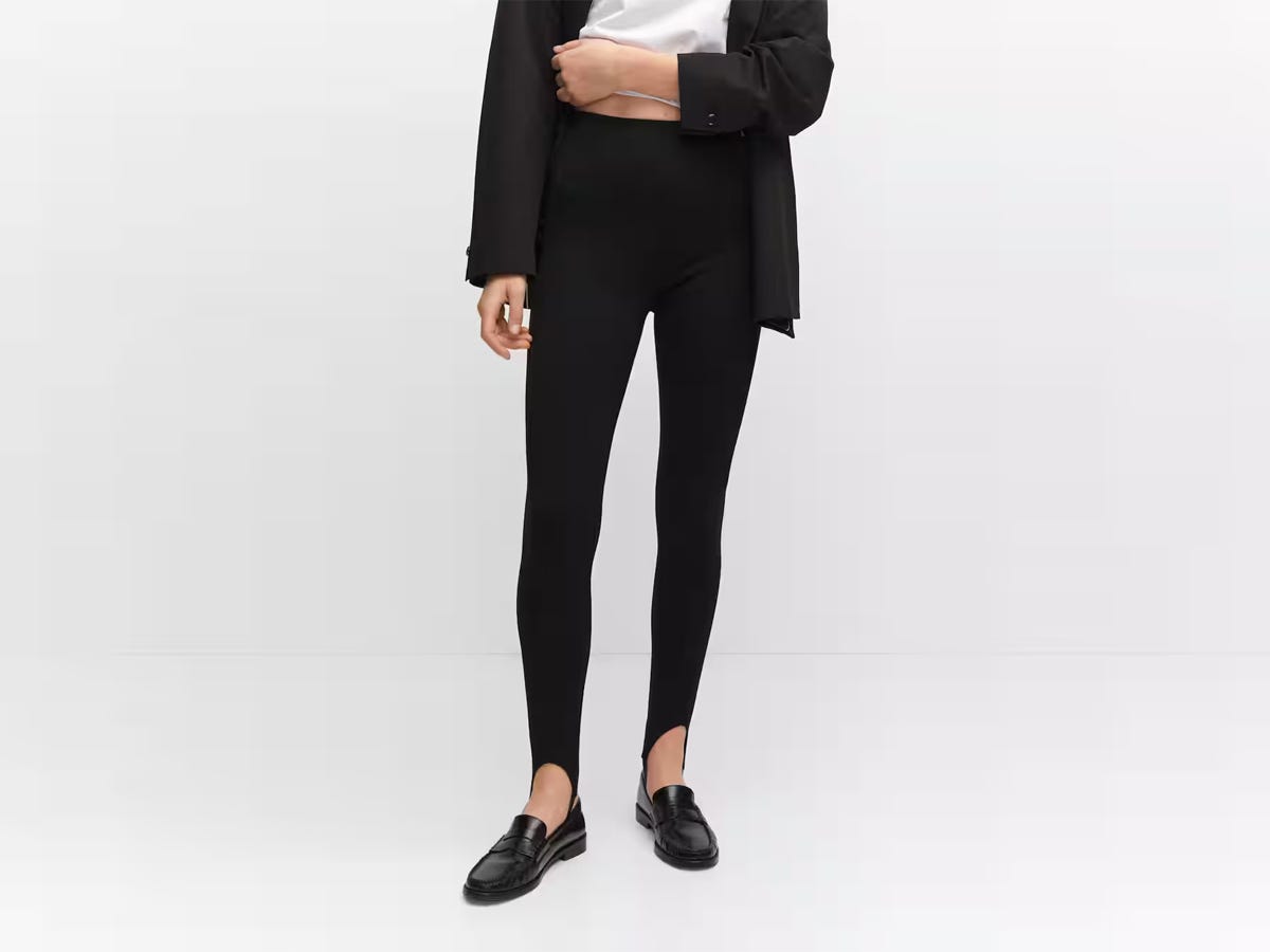 A person wearing the Mango Fuseau Legging with Seams.