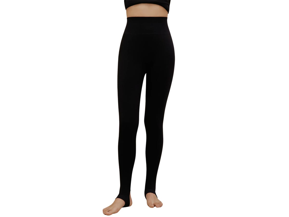 A person wearing the Neiwai x Wolford Stirrup Leggings.