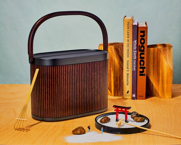 Is it a lunch box? A picnic basket? A sleek, unobtrusive storage solution for your various bits and bobs? No, it’s a powerful speaker, cloaked in dark  oak, bright woven caning, or aluminum mesh and pretty enough to display with pride.