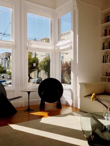 In the living room, the black circle chairs are by Haddock Studio, the firm that did the redesign.