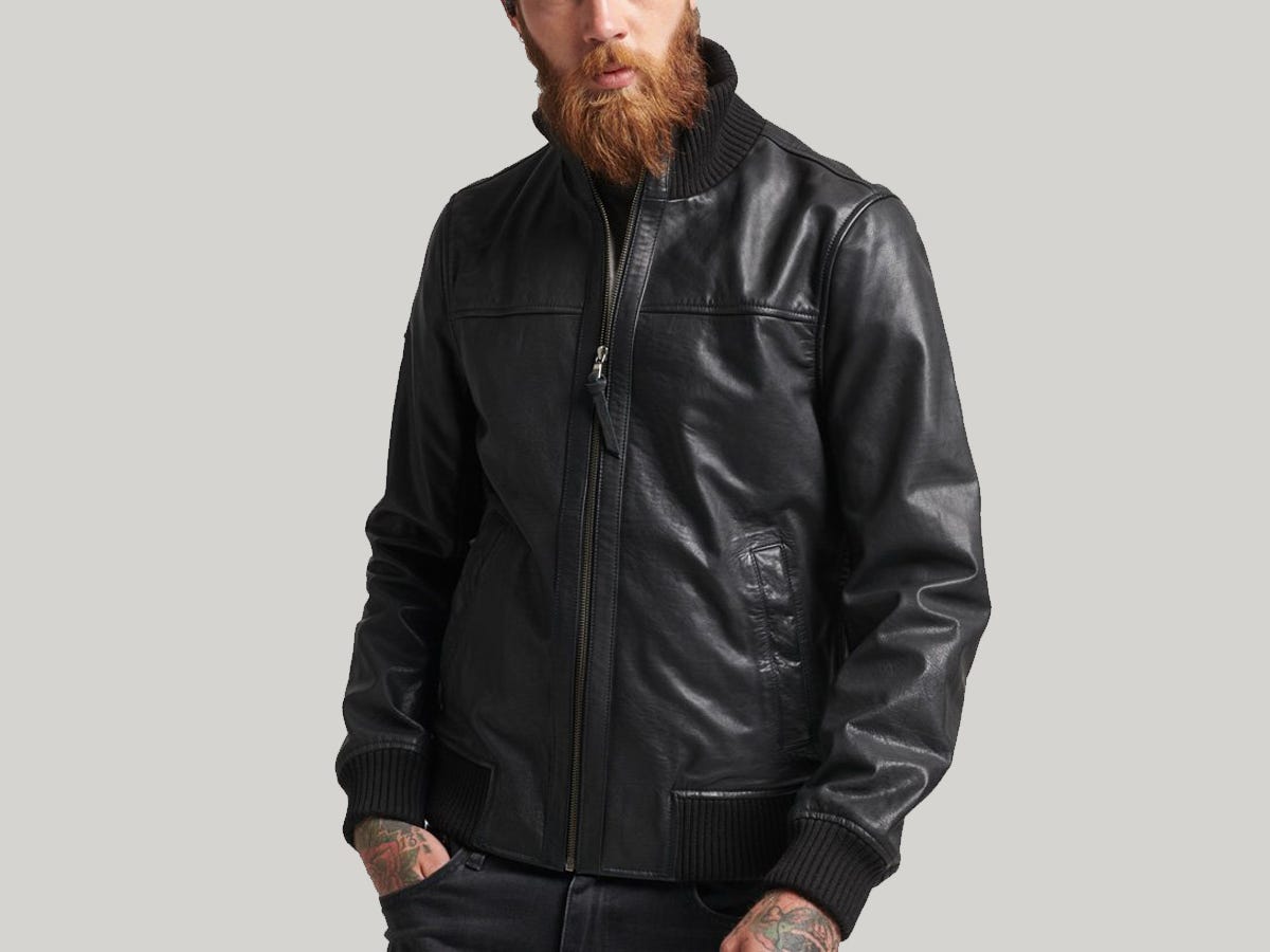 A model wearing the Superdry Knitted Collar Leather Bomber Jacket in black.