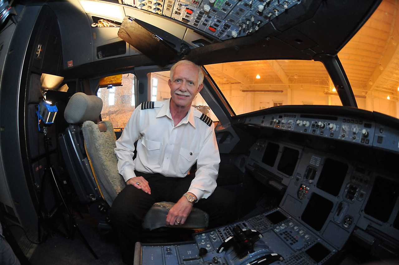 Captain Sully in the cockpit of the A320 that he crash-landed in the Hudson after it went on display.