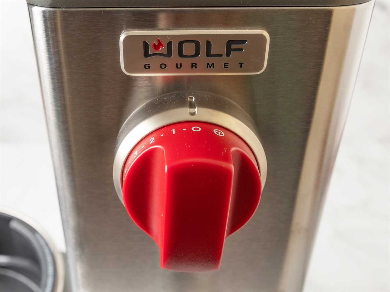 The red variable speed dial on the Wolf Gourmet Stand Mixer.