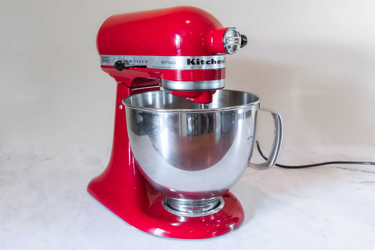 An empire red KitchenAid 5-Quart Stand Mixer against a white background.