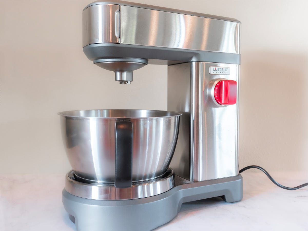 A stainless steel Wolf Gourmet stand mixer on a white background.