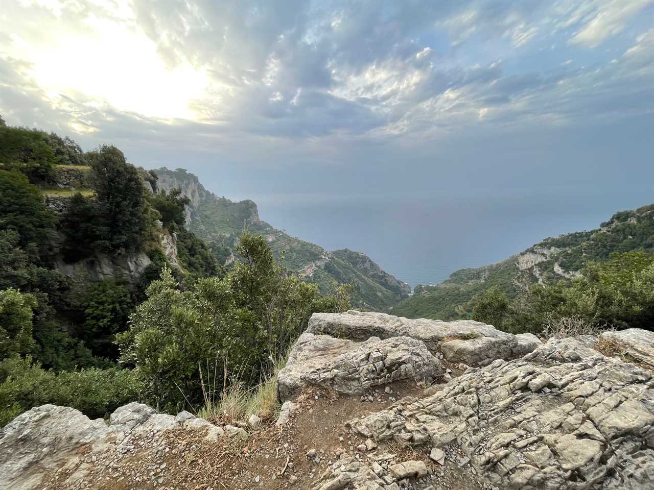 The sun rising on a mountain on the Path of the Gods