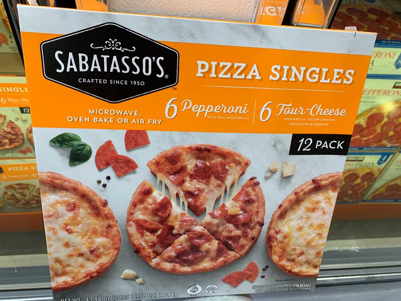 A box of Sabatasso's pizza singles: six pepperoni and six four cheese.