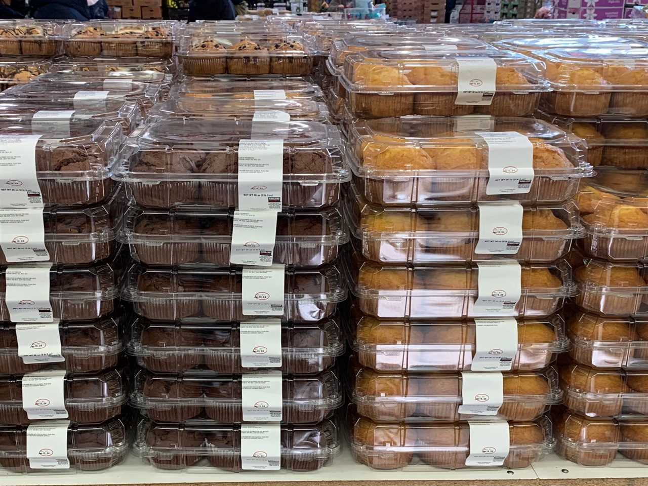 Packages of different flavors of muffins on display at Costco