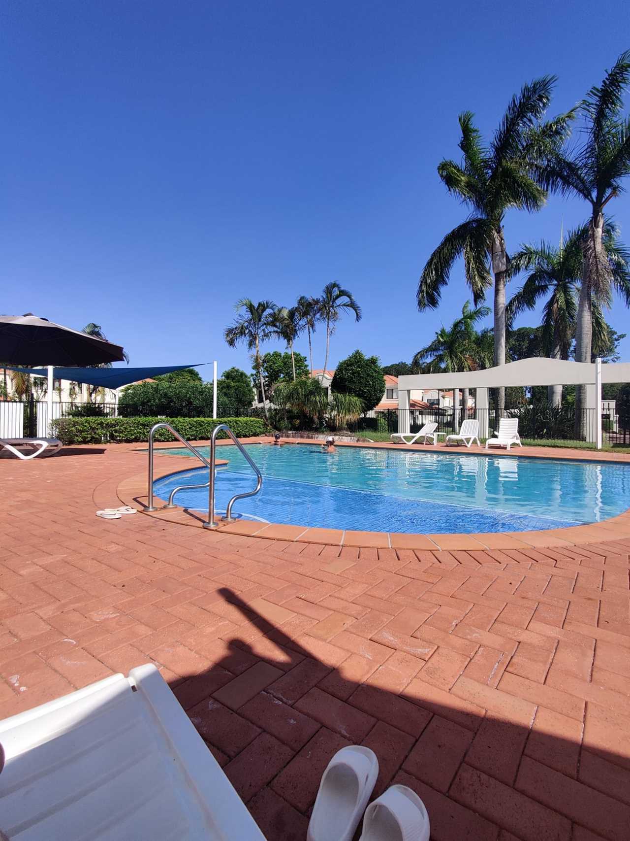 A sunny Australian house complex with pool.