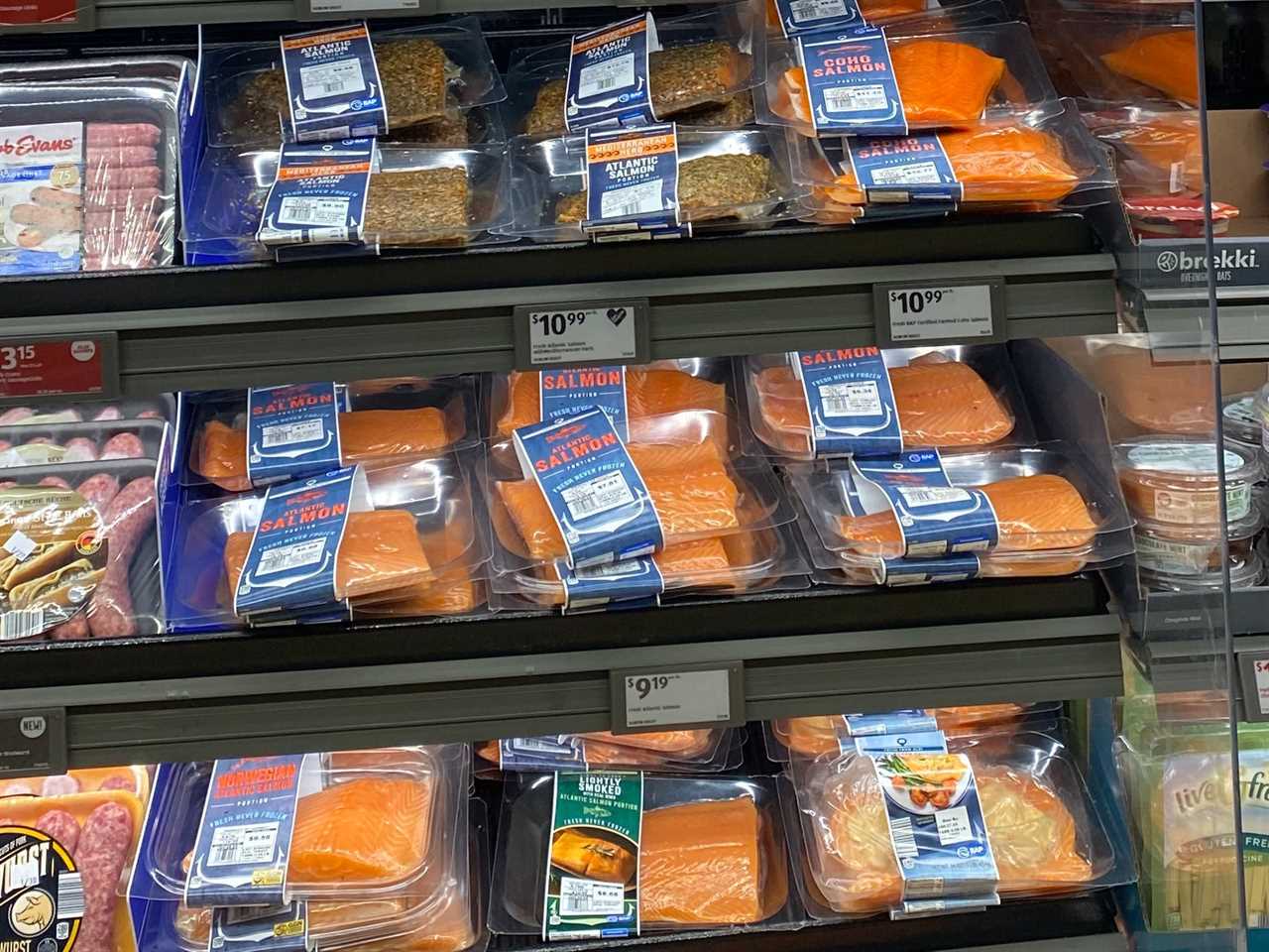 Shelves of seafood including salmon and cod at Aldi