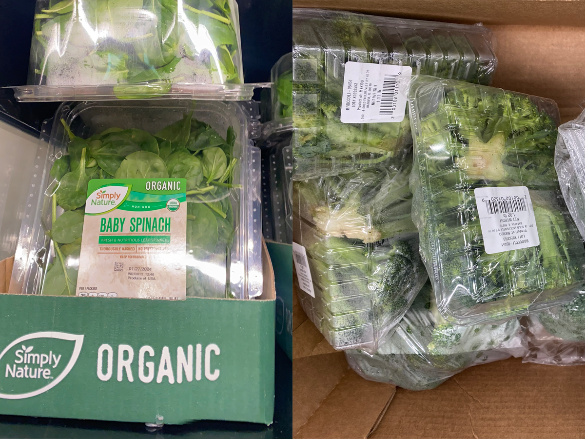 Clear plastic containers of Simply Nature spinach in green cardboard box; Clear plastic containers of broccoli in cardboard box at Aldi