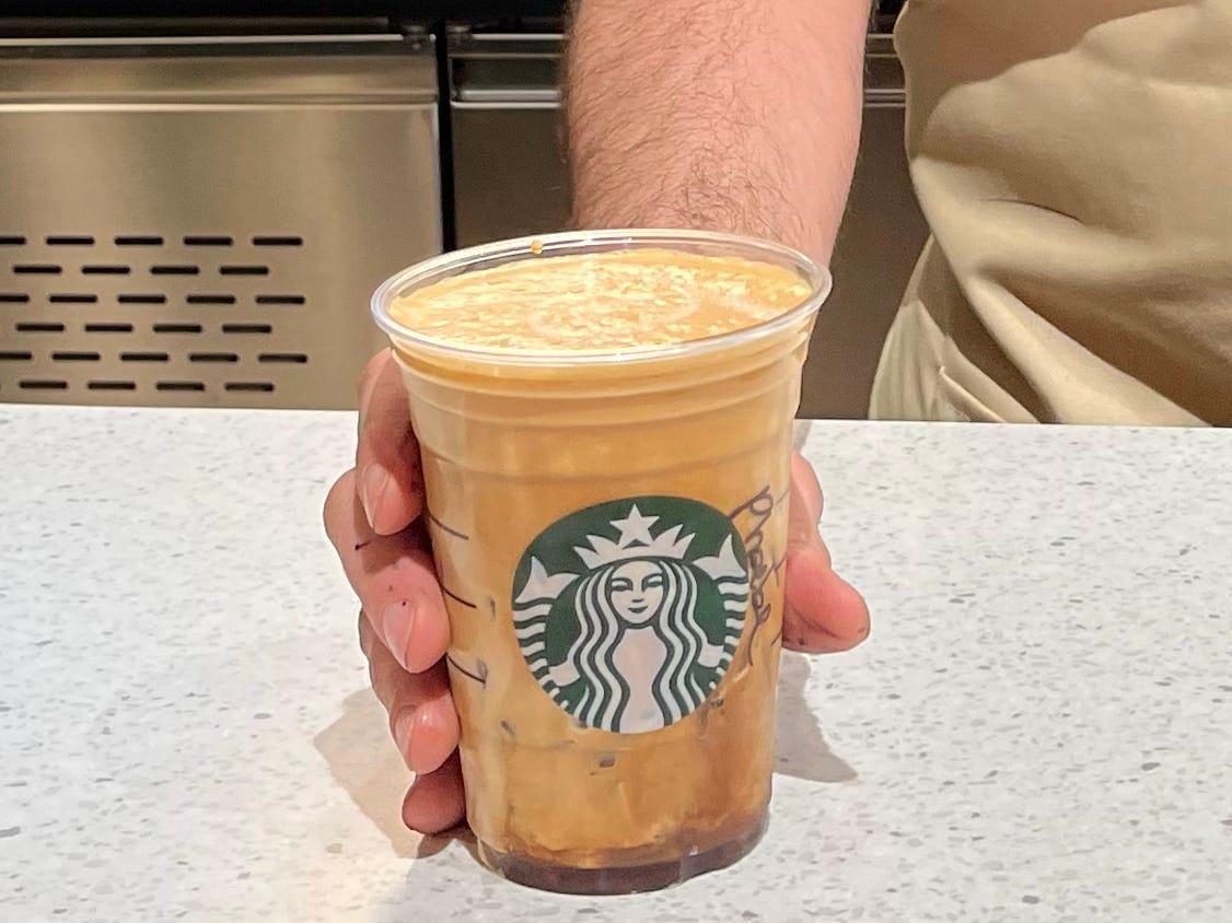 starbucks barista giving the Oleato iced shaken espresso