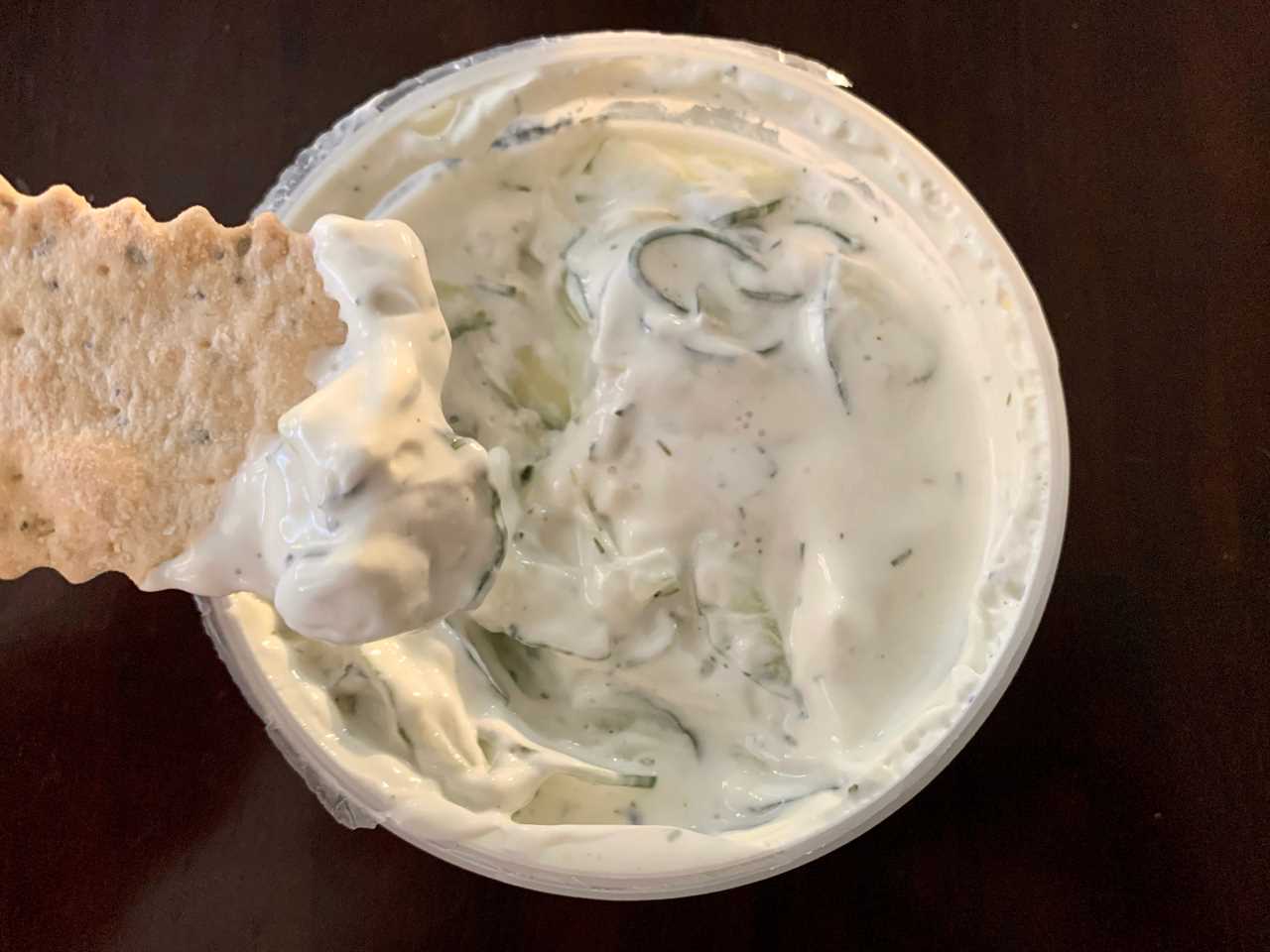 chip dipping into trader joe's tzatziki