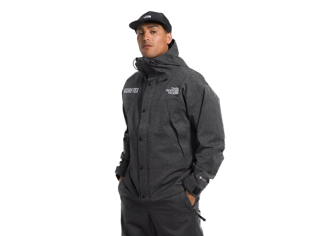 A man wearing The North Face Mountain Jacket in black denim