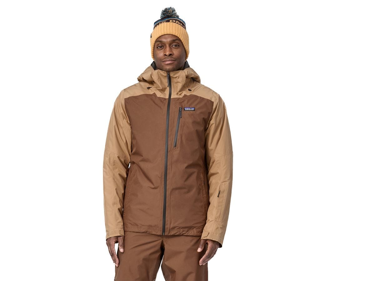 A man wearing a brown Patagonia rain jacket