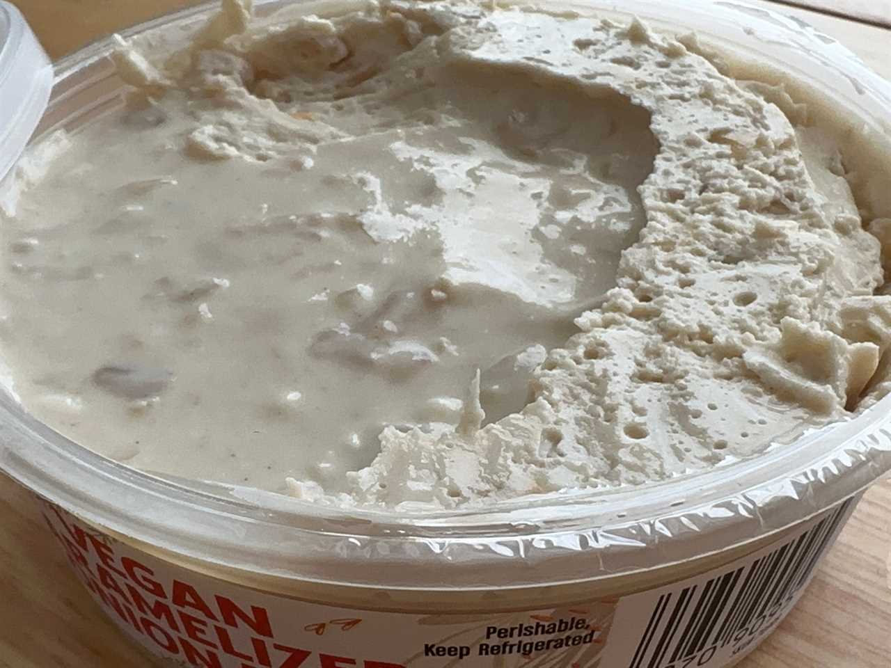 An open container of Trader Joe's vegan caramelized-onion dip