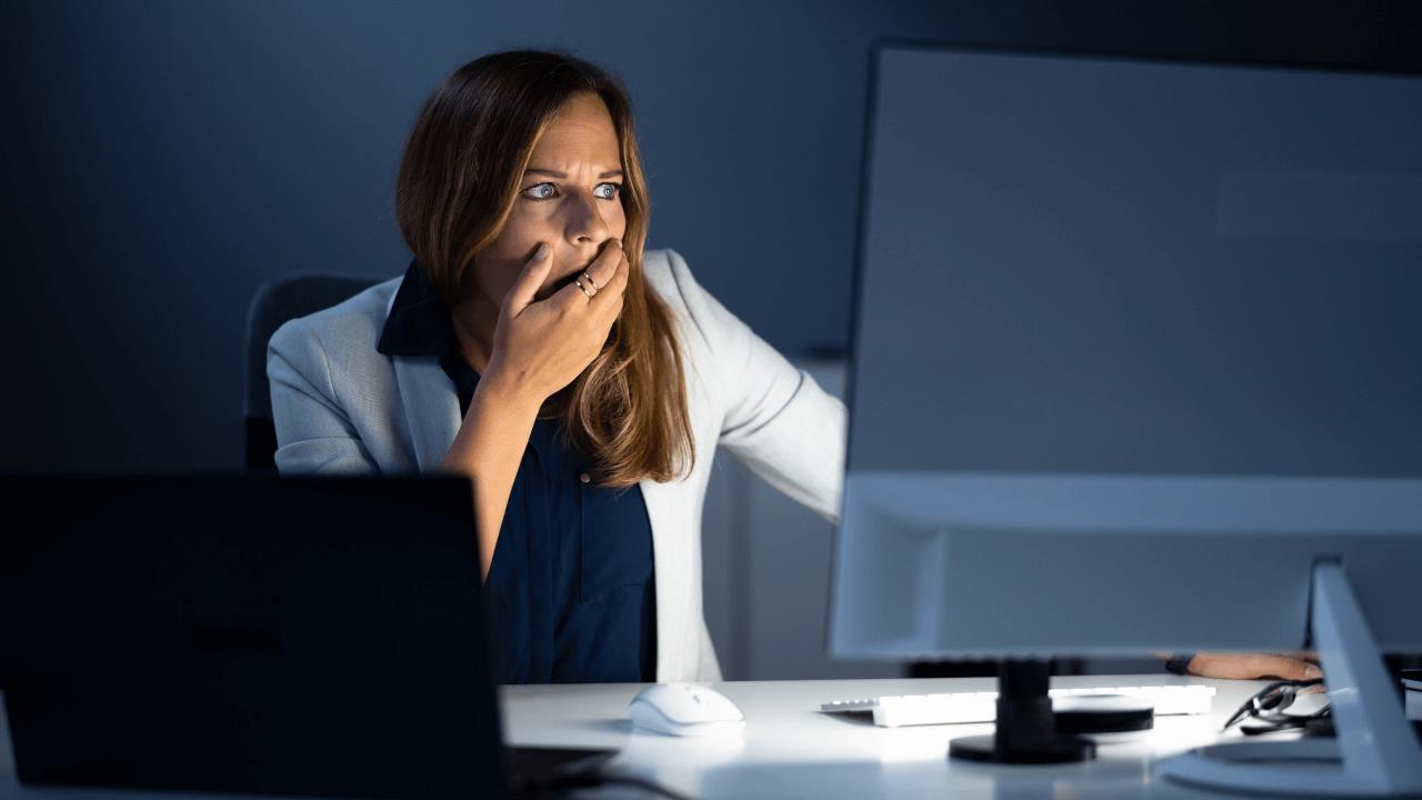 Woman looking at a lateral phishing attack result on her PC