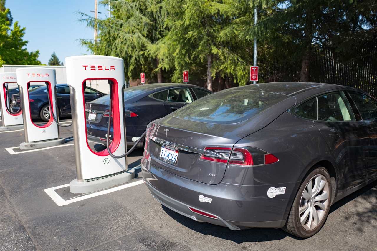 Tesla vehicles plugged in and charging at a Supercharger rapid battery charging station for the electric vehicle company Tesla Motors, in the Silicon Valley town of Mountain View, California, August 24, 2016.