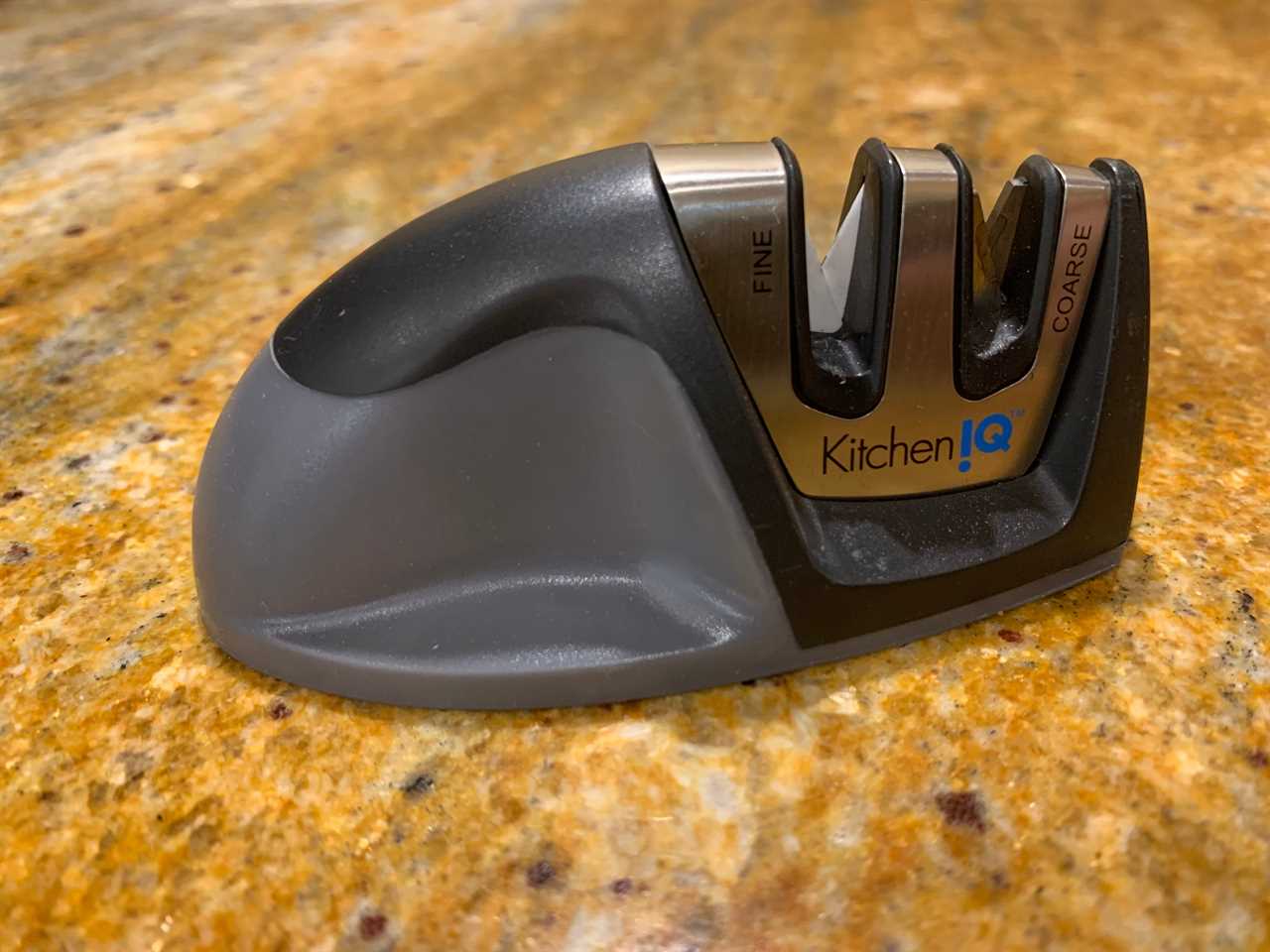 The KitchenIQ Edge Grip 2-Stage sharpener on a granite countertop.