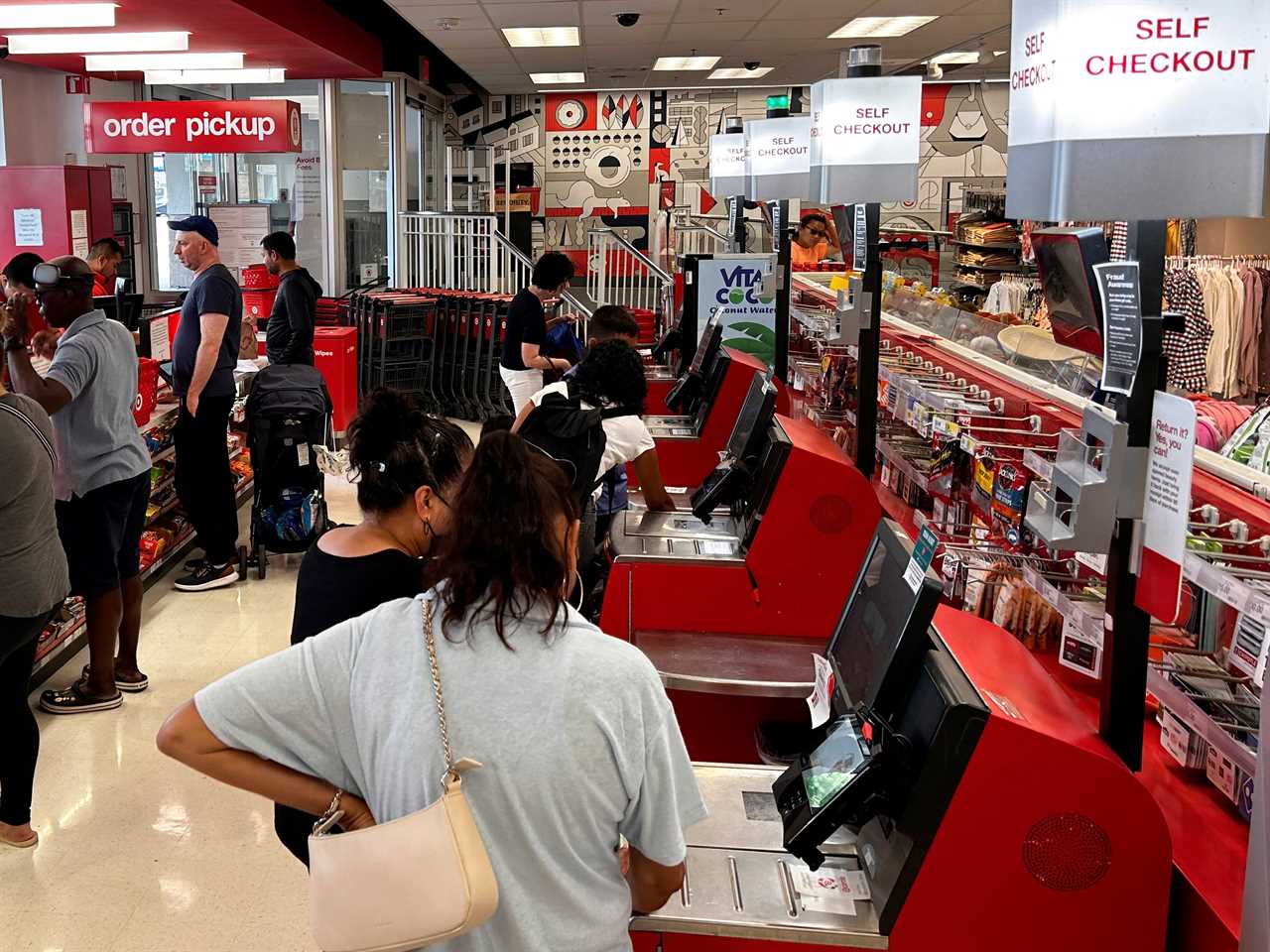 Busy Self checkout vs busy cashier check out at Target Store, Queens, New York. 